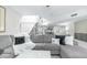Inviting living room with sectional sofa, staircase, and decor at 2615 N Hayden Rd # 114, Scottsdale, AZ 85257
