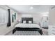 Relaxing main bedroom features comfy king bed with plenty of pillows, and an ensuite bathroom at 2615 N Hayden Rd # 114, Scottsdale, AZ 85257