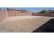 Spacious dirt lot in a backyard with privacy wall at 30268 W Sheila Ln, Buckeye, AZ 85396