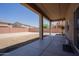 Covered patio and spacious backyard with privacy wall at 30268 W Sheila Ln, Buckeye, AZ 85396