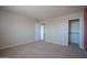 Neutral bedroom with carpeted floor, walk-in closet, and access to other rooms at 30268 W Sheila Ln, Buckeye, AZ 85396