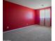 Spacious bedroom with neutral carpet and bright window allowing natural light to illuminate the space at 30268 W Sheila Ln, Buckeye, AZ 85396
