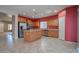 Bright kitchen featuring stainless steel appliances, an island, and tile flooring at 30268 W Sheila Ln, Buckeye, AZ 85396