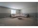 Inviting living room with plush sectional sofa and stylish coffee table perfect for relaxation at 30268 W Sheila Ln, Buckeye, AZ 85396