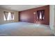 Inviting living room with large windows offering natural light and a cozy atmosphere at 30268 W Sheila Ln, Buckeye, AZ 85396