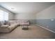 Comfortable living room featuring plush sectional and a modern coffee table, ideal for unwinding at 30268 W Sheila Ln, Buckeye, AZ 85396