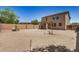 Expansive backyard featuring a desert landscape and block fence offering privacy and space at 3228 W Saint Anne Ave, Phoenix, AZ 85041