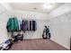Walk-in closet with clothes, shelves, shoes, and a golf bag at 3228 W Saint Anne Ave, Phoenix, AZ 85041