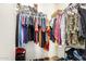 Walk-in closet with metal racking system, shelves, rods, and carpeted floor at 3228 W Saint Anne Ave, Phoenix, AZ 85041