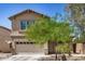 Charming two-story home featuring a two-car garage and desert landscaping in a sunny setting at 3228 W Saint Anne Ave, Phoenix, AZ 85041