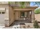 Charming front porch featuring decorative chairs, stone accents, and a welcoming entrance at 3228 W Saint Anne Ave, Phoenix, AZ 85041