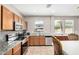 Bright kitchen with stainless steel appliances and backyard pool view at 3228 W Saint Anne Ave, Phoenix, AZ 85041