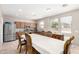 Bright kitchen and eating area with stainless steel appliances and wood cabinets at 3228 W Saint Anne Ave, Phoenix, AZ 85041