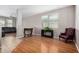 Inviting living room showcasing stylish wood laminate flooring, neutral walls and ample light at 3228 W Saint Anne Ave, Phoenix, AZ 85041