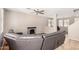 Open-concept living space featuring laminate flooring and a corner electric fireplace feature at 3228 W Saint Anne Ave, Phoenix, AZ 85041