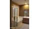 Well-lit bathroom featuring a glass enclosed shower and a soaking tub with window and shutter at 34464 N 68Th Way, Scottsdale, AZ 85266