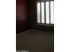 Bedroom with neutral carpet and a window with shutters at 34464 N 68Th Way, Scottsdale, AZ 85266