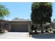 Charming single-story home with a tile roof, desert landscaping, and an attached two-car garage at 34464 N 68Th Way, Scottsdale, AZ 85266