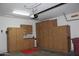 Large garage with extensive built-in storage cabinets, providing organization and functionality at 34464 N 68Th Way, Scottsdale, AZ 85266