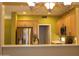 Open kitchen view featuring wood cabinetry, stainless steel appliances, and bar countertop at 34464 N 68Th Way, Scottsdale, AZ 85266