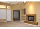 Spacious living room with fireplace, built-ins, and lots of natural light at 34464 N 68Th Way, Scottsdale, AZ 85266