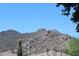 Expansive view of the desert mountainside, complimented by native cacti and tile rooftops at 34464 N 68Th Way, Scottsdale, AZ 85266