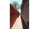Picture of side yard of property with brick wall and gravel path at 34464 N 68Th Way, Scottsdale, AZ 85266