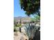 Scenic street view with lush desert landscaping, neighboring homes, and beautiful mountain views at 34464 N 68Th Way, Scottsdale, AZ 85266