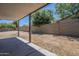 Backyard featuring a covered patio area with a view of the perimeter fencing at 3701 W Villa Maria Dr, Glendale, AZ 85308