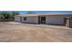 Exterior view of home showcasing its large backyard and stucco siding at 3701 W Villa Maria Dr, Glendale, AZ 85308