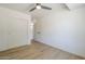 Bright, neutral room with wood-look floors, bright window, and a closet at 3701 W Villa Maria Dr, Glendale, AZ 85308