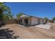 Back exterior featuring a covered patio area and a view of the backyard at 3701 W Villa Maria Dr, Glendale, AZ 85308
