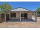 Backyard featuring a covered patio area and a view of the back exterior at 3701 W Villa Maria Dr, Glendale, AZ 85308