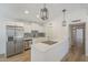 Modern kitchen features stainless steel appliances, sleek countertops, and ample cabinet space at 3701 W Villa Maria Dr, Glendale, AZ 85308