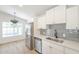 Charming kitchen features stainless appliances, and white cabinetry at 3701 W Villa Maria Dr, Glendale, AZ 85308