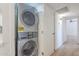 Convenient laundry room featuring a stacked washer and dryer at 3701 W Villa Maria Dr, Glendale, AZ 85308