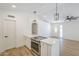 Open-concept kitchen and living area featuring modern appliances and stylish finishes at 3701 W Villa Maria Dr, Glendale, AZ 85308