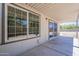 Back patio with sliding glass doors and large windows at 3701 W Villa Maria Dr, Glendale, AZ 85308