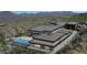 Aerial view of a home nestled in the desert landscape with a pool at 39307 N Silver Saddle Dr, Carefree, AZ 85377