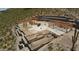 Aerial view of a home under construction featuring a pool in the desert landscape at 39307 N Silver Saddle Dr, Carefree, AZ 85377