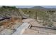 New home construction with wood framing on desert hillside near road at 39307 N Silver Saddle Dr, Carefree, AZ 85377