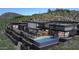 Stunning contemporary home featuring a backyard pool and elevated fire pit at 39307 N Silver Saddle Dr, Carefree, AZ 85377