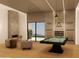 Spacious game room featuring a modern fireplace, pool table, and sliding doors with a view at 39307 N Silver Saddle Dr, Carefree, AZ 85377