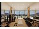 Spacious gym with floor to ceiling windows offering views of the neighborhood and the desert landscape at 39307 N Silver Saddle Dr, Carefree, AZ 85377