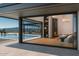 Open living space with fireplace, sliding glass doors, and a view of the pool at 39307 N Silver Saddle Dr, Carefree, AZ 85377