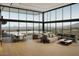 Bright, modern living room features floor-to-ceiling windows with mountain views at 39307 N Silver Saddle Dr, Carefree, AZ 85377