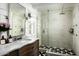 Modern bathroom featuring a glass shower with a tiled floor, a sink, and a beautiful design at 4125 N 64Th St, Scottsdale, AZ 85251