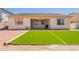 Backyard with new artificial turf and covered patio at 4235 S Snowcap Dr, Gilbert, AZ 85297