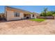 Large backyard with artificial turf pad and covered patio at 4235 S Snowcap Dr, Gilbert, AZ 85297