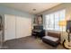 Comfortable bedroom with modern closet, window, electric piano, sofa and guitar at 4235 S Snowcap Dr, Gilbert, AZ 85297